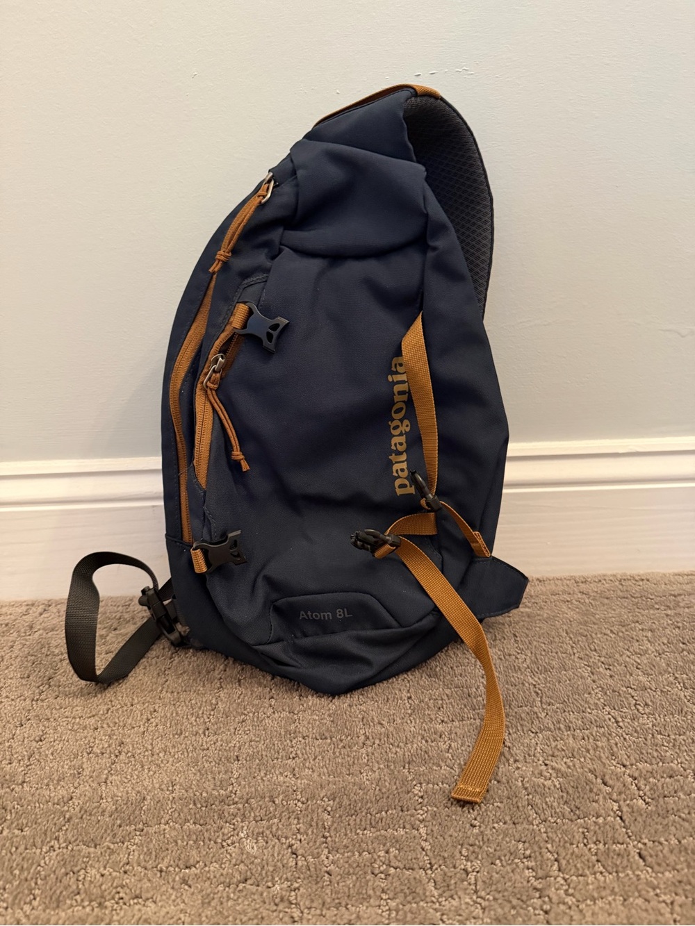 Patagonia Navy Blue Sling Backpack with Tan Accents